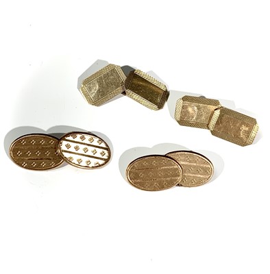 Lot 2396 - Two pairs of 9ct gold engine turned cufflinks...