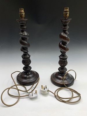 Lot 269 - A pair of dark oak barley twist and acanthus...