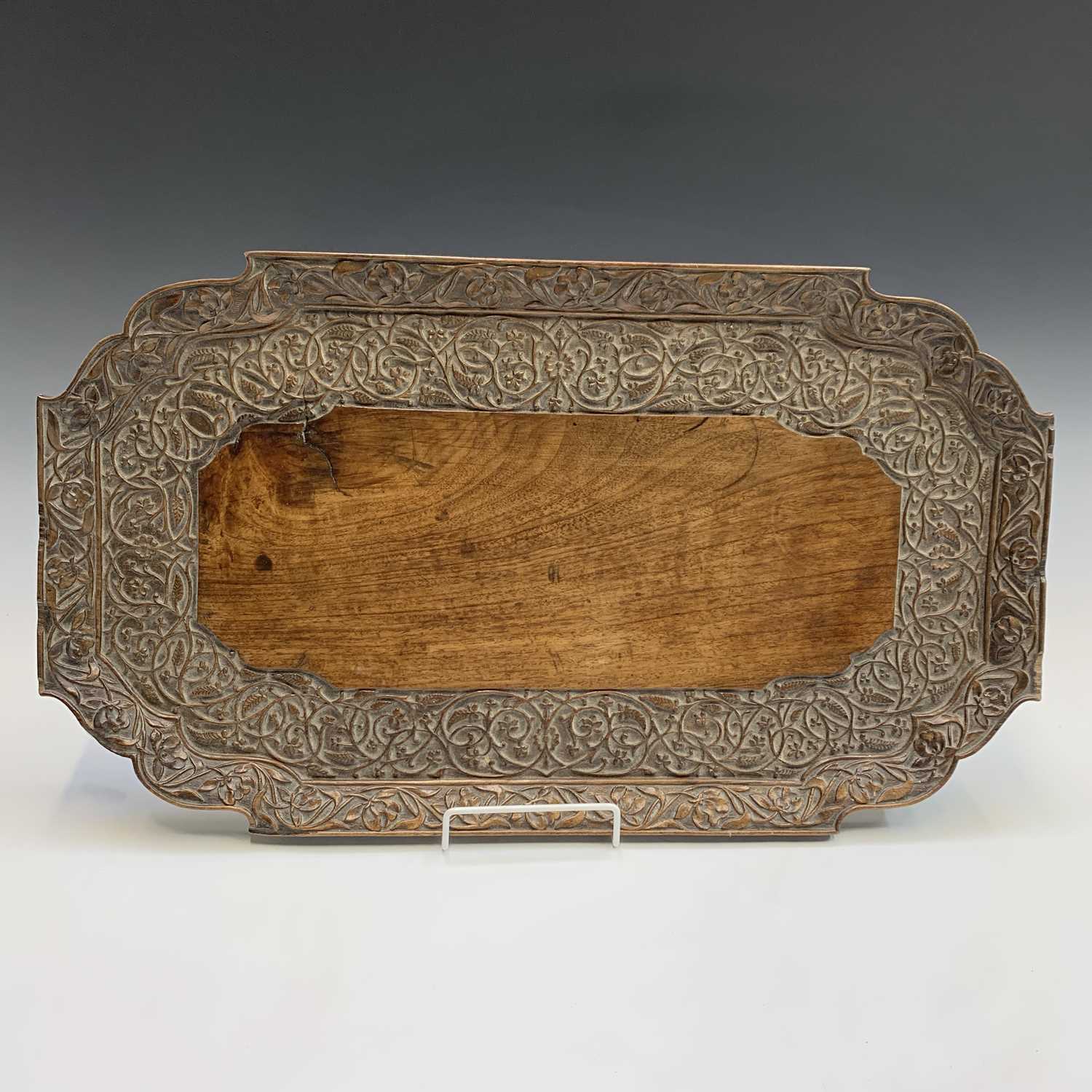 Lot 424 An Indian carved wood tray, early 20th