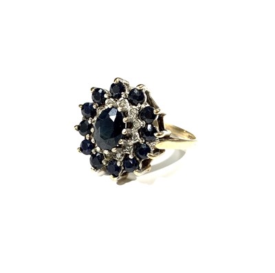 Lot 2454 - A 9ct gold cluster ring set blue and white stones