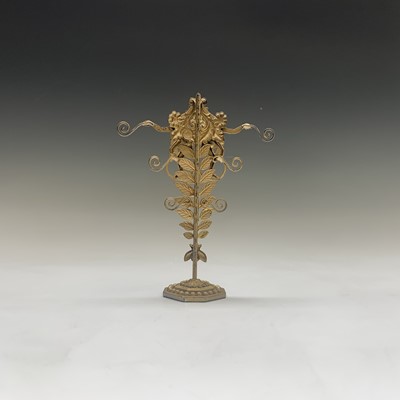 Lot 743 - A monkey cast earring stand by Askew London