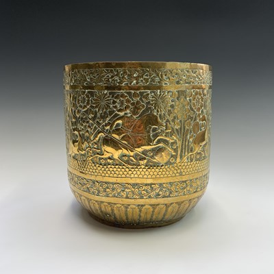 Lot 54 - An Indian brass jardiniere, embossed with a...