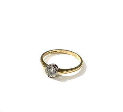 Lot 2382 - An 18ct gold ring set a diamond of...