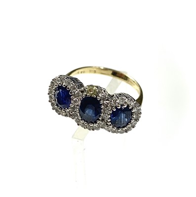 Lot 2478 - An 18ct gold sapphire and diamond triple...