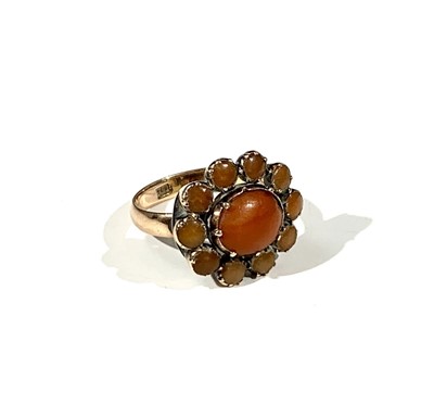 Lot 2424 - An antique 9ct gold red coral oval cluster ring