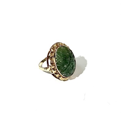 Lot 2475 - A 14ct gold ring set a carved jade panel