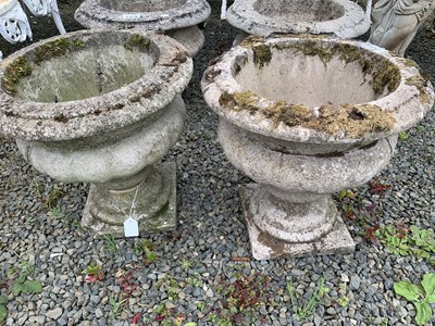 Lot 321 - A pair of concrete urns