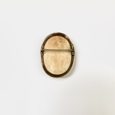 Lot 184 - A Chinese Canton carved ivory oval brooch,...