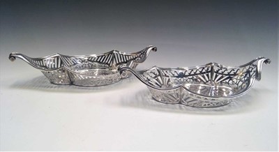 Lot 2032 - Two similar pierced silver, shaped baskets...