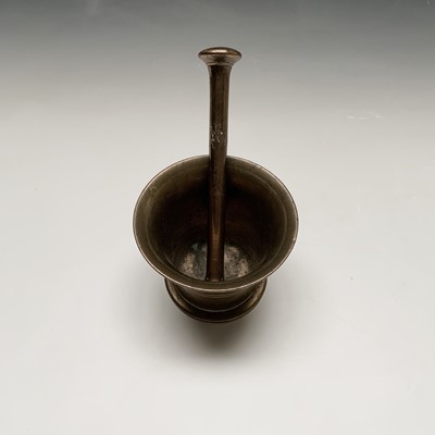 Lot 35 - A brass mortar and pestle. Height of mortar...