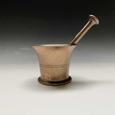 Lot 35 - A brass mortar and pestle. Height of mortar...