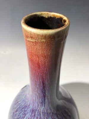 Lot 49 - A Chinese flambe glazed bottle vase, 18th...