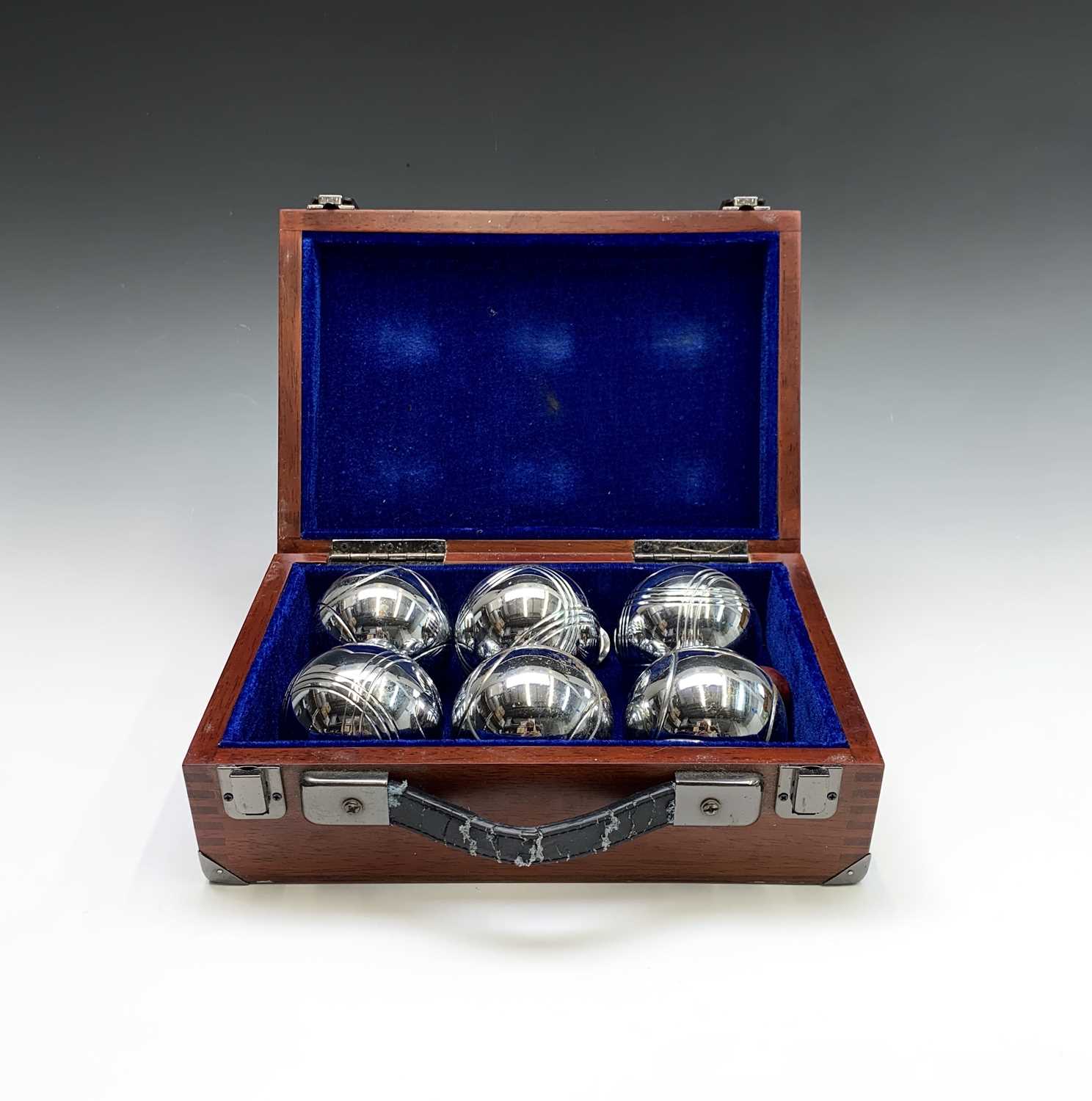 Lot 14 - A set of chrome boules, with jack in a wooden...