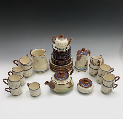 Lot 945 - A Watcombe Torquay Mottoware pottery tea and...