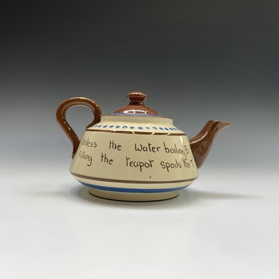 Lot 945 - A Watcombe Torquay Mottoware pottery tea and...