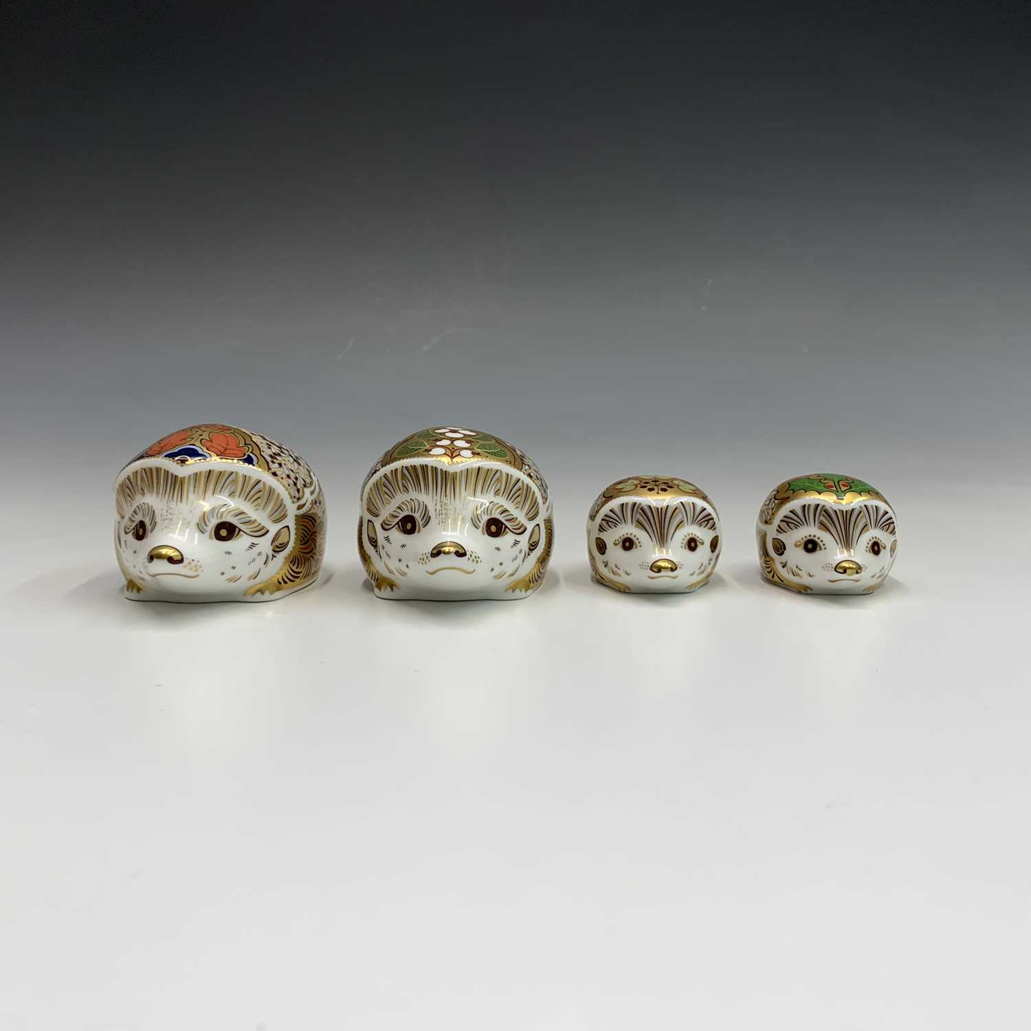 Lot 825 - Four Royal Crown Derby hedgehog paperweights -...