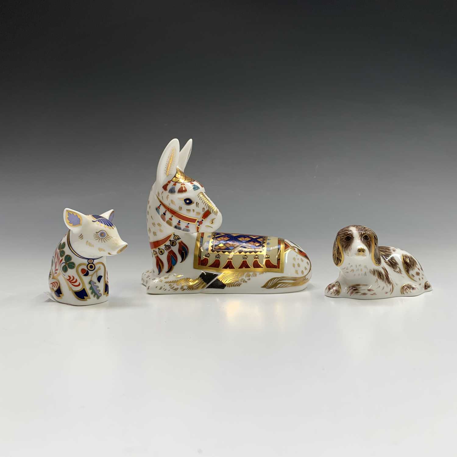 Lot 829 - Three Royal Crown Derby paperweights -...