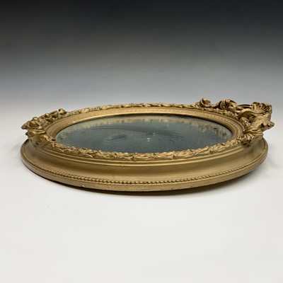 Lot 656 - A late 19th century oval gilt small wall...