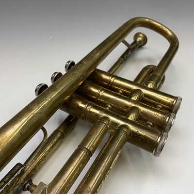 A B&M CHAMPION BRASS TRUMPET With two mouthpieces, in hard carry case.  (case 55cm x 18cm x 12cm)