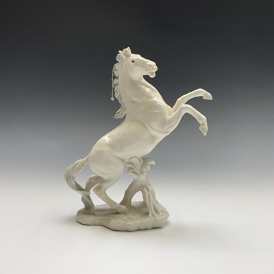 Lot 808 - A Karl Ens porcelain model of a rearing horse,...