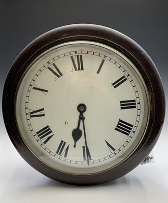 Lot 2909 - A mahogany circular wall clock, with a single...