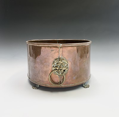 Lot 4 - A copper plant trough of oval form, with brass...