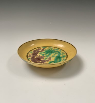 Lot 126 - A Chinese yellow ground porcelain dish,...