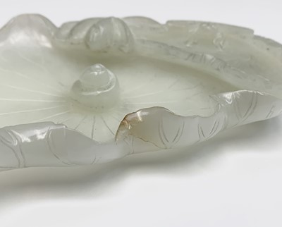 Lot 11 - A Chinese white jade 'lotus leaf' brushwasher,...