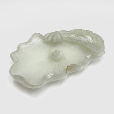 Lot 11 - A Chinese white jade 'lotus leaf' brushwasher,...