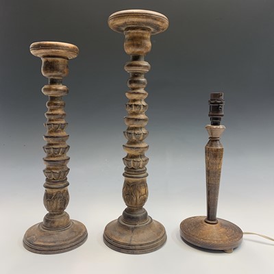 Lot 156 - Two turned wood acanthus design candle stands,...