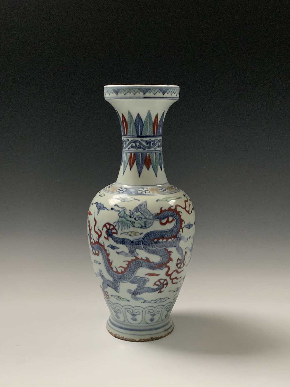 Lot 34 - A Chinese Wucai porcelain baluster vase, Wanli...