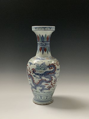 Lot 34 - A Chinese Wucai porcelain baluster vase, Wanli...
