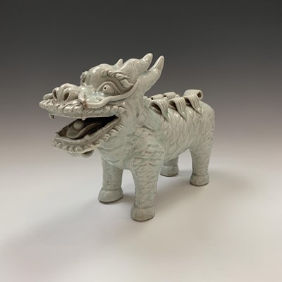 Lot 159 - A Chinese celadon glazed pottery dog of fo,...