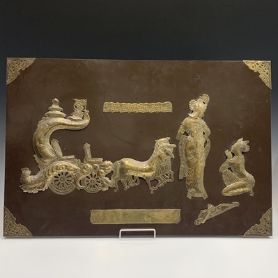 Lot 255 - An Indian brass mounted and lacquered wood...