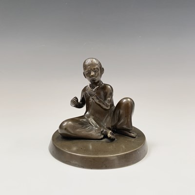 Lot 161 - A Japanese bronze figure of a seated boy,...