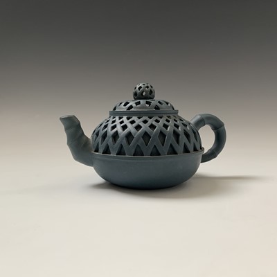 Lot 157 - A Chinese yixing pottery reticulated teapot,...