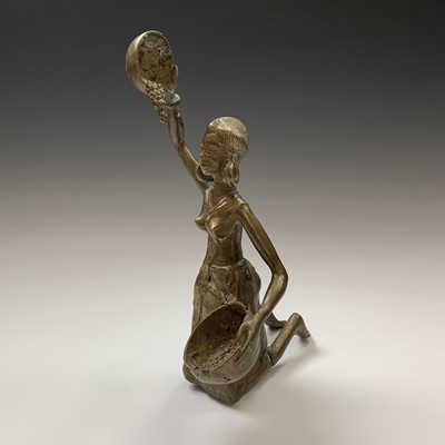 Lot 158 - A heavy Benin bronze figure of a kneeling lady,...
