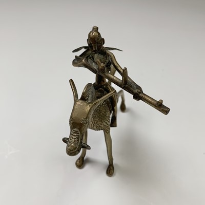 Lot 158 - A heavy Benin bronze figure of a kneeling lady,...