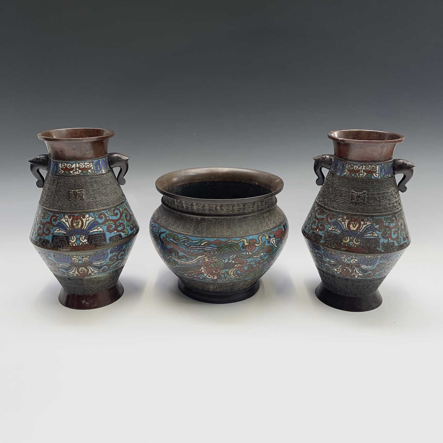 Lot 40 - A pair of Chinese bronze champleve vases and a...