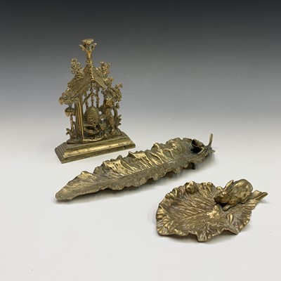 Lot 110 - A French cast brass figure of a rabbit on a...