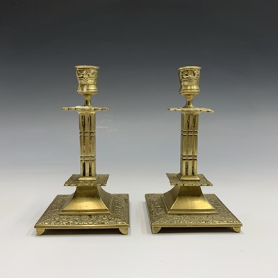 Lot 256 - A pair of 19th century cast brass candlesticks,...