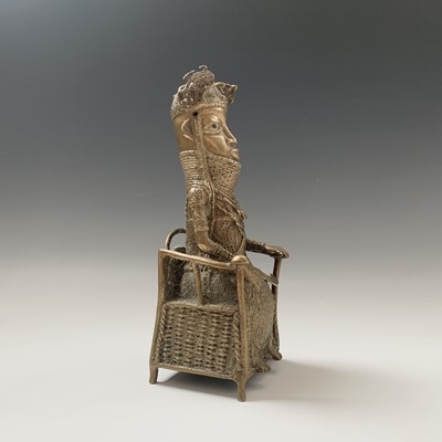 Lot 216 - A Bennin bronze model of a seated chief,...