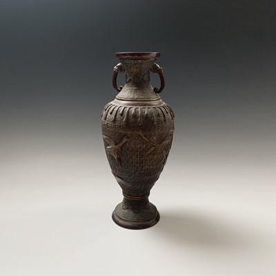 Lot 213 - A Japanese bronze twin-handled vase, Meiji...