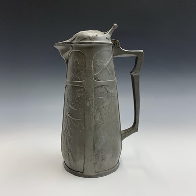 Lot 152 - A Continental large pewter jug decorated...