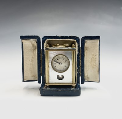 Lot 244 - A French miniature alarm clock, with dummy...