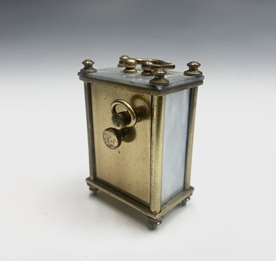 Lot 20 - A French miniature alarm clock, with dummy...