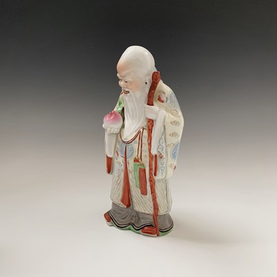 Lot 163 - A Chinese porcelain figure of buddha, 20th...