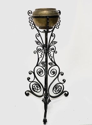 Lot 164 - An Arts and Crafts wrought iron jardiniere...