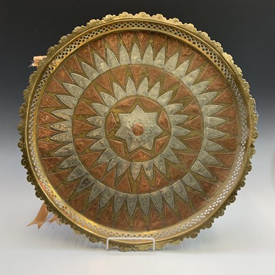 Lot 131 - A large Eastern brass tray, 1920s, with copper...
