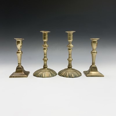 Lot 43 - A pair of George III brass candlesticks with...